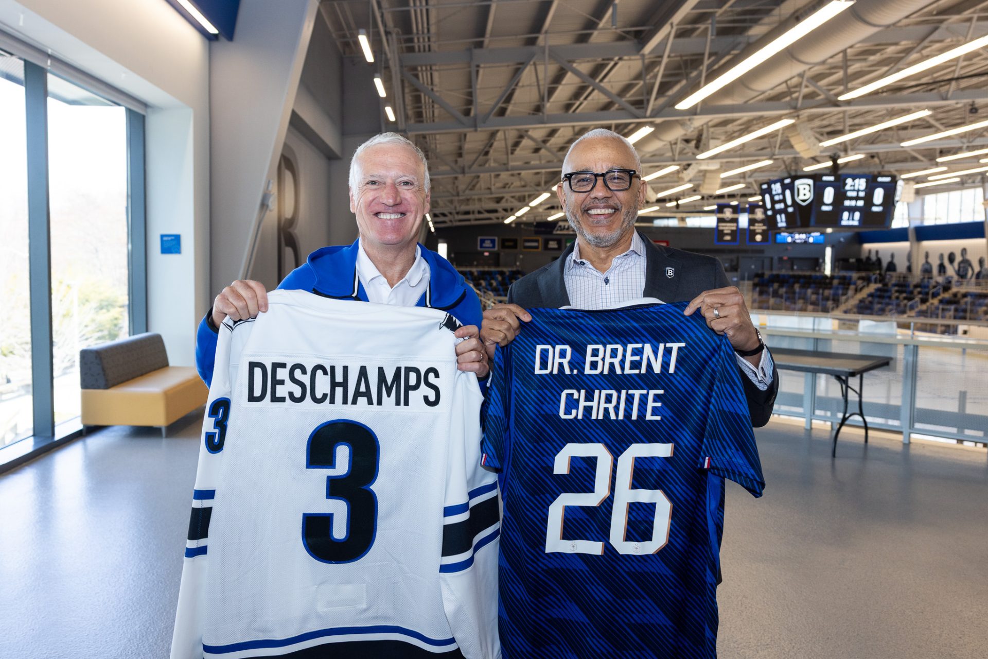 Didier Deschamps — manager of French national football team, l’équipe de France de football — and Bentley President E. LaBrent Chrite hold team jerseys