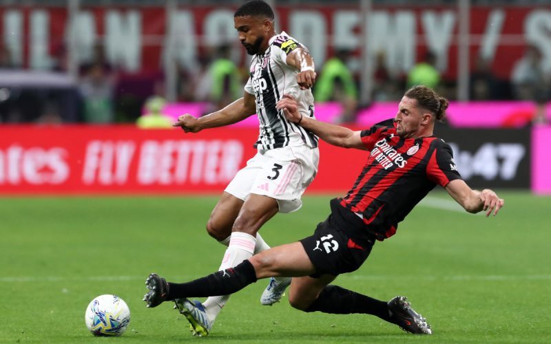 MILAN, ITALY - APRIL 26: Bremer of Juventus is challenged by Adrien Rabiot of AC Milan during the Serie A match between AC Milan and Juventus FC at Giuseppe Meazza Stadium on April 26, 2026 in Milan, Italy. (Photo by Marco Luzzani/Getty Images)